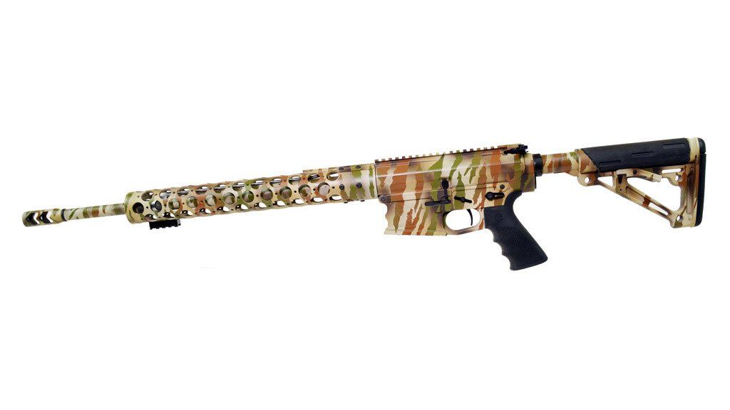 Camouflaged rifle with a black grip and stock, on a white background.