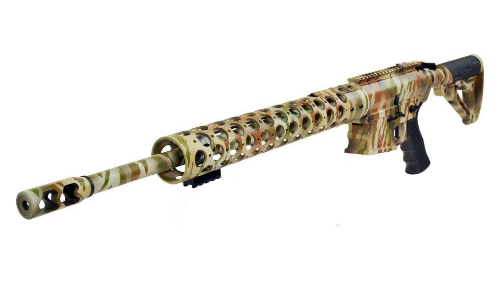 Camouflage-patterned rifle with a long barrel and vented handguard, against a white background.