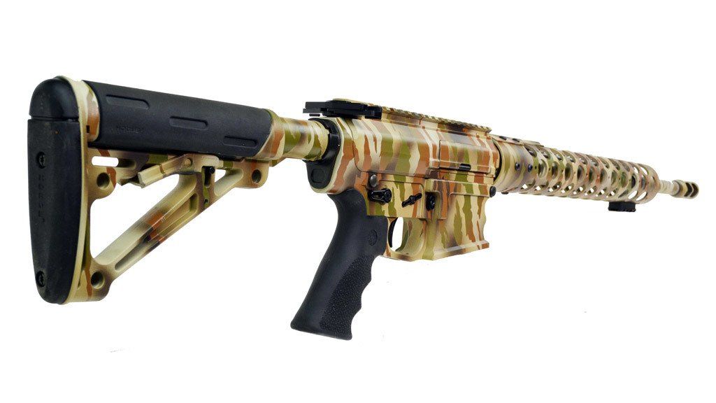 Camouflage rifle with black grip and stock on a white background.