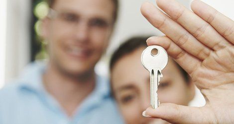 A woman holding a key