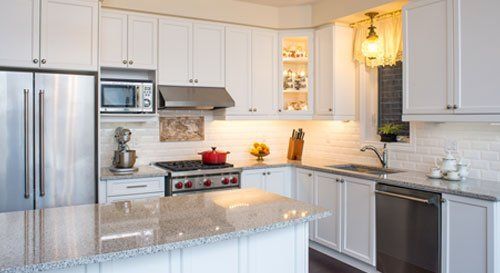 kitchen with island and granite countertops renovated by ener-g tech, inc.