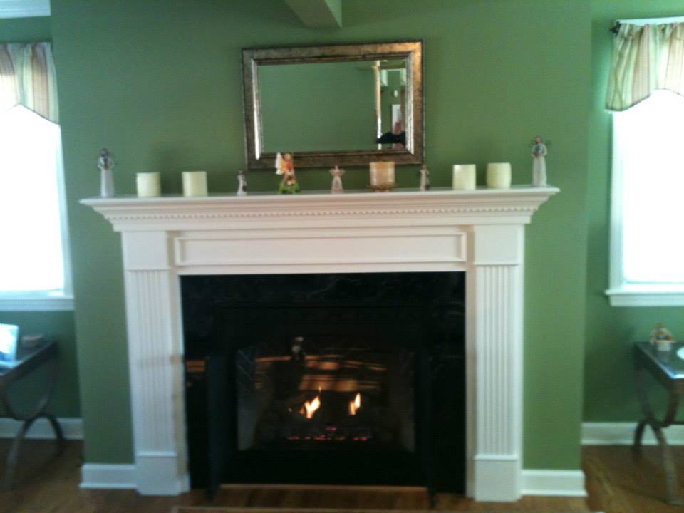 fireplace with white mantel installed by ener-g tech, inc.