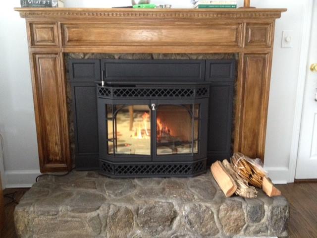 fireplace with wood mantel installed by ener-g tech, inc.