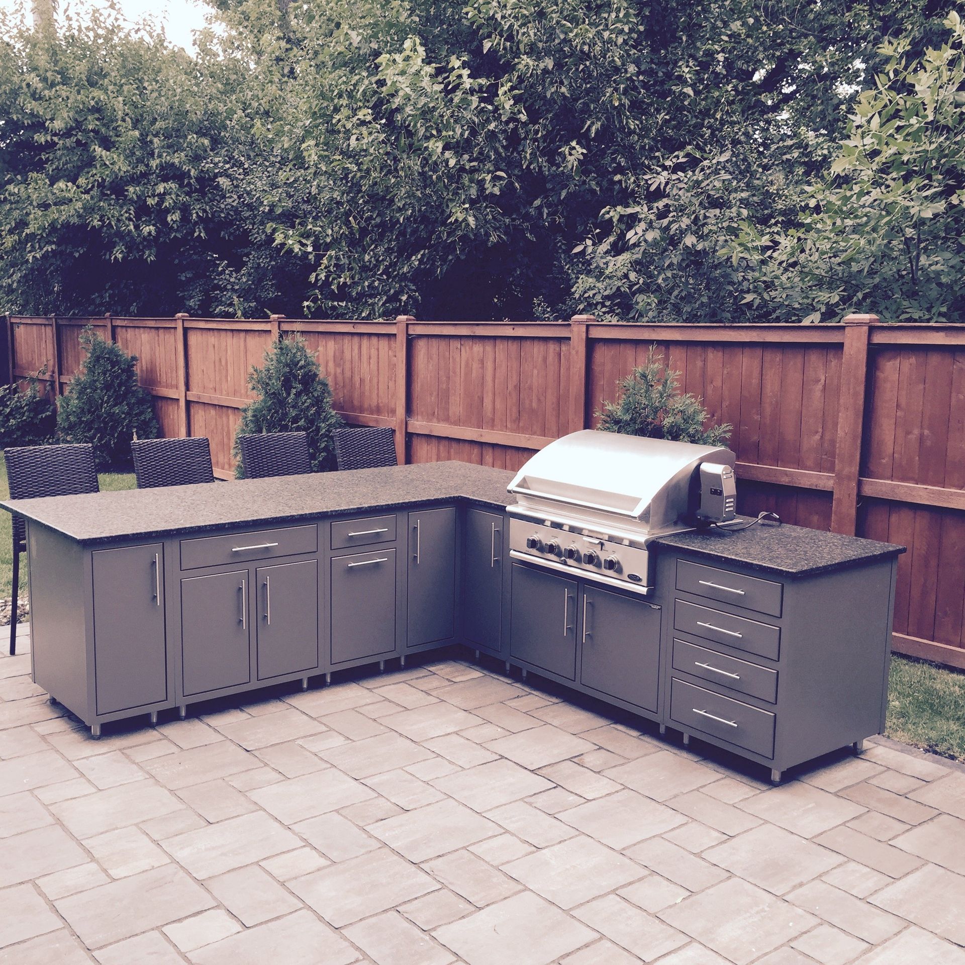 outdoor cooking and eating area - grill, countertops, chairs