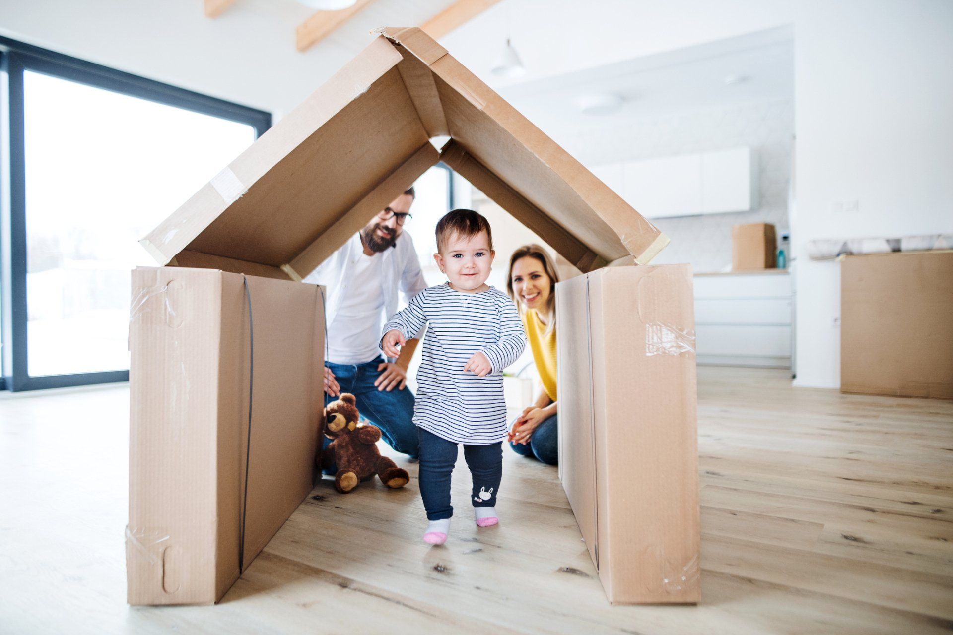 baby and moving boxes