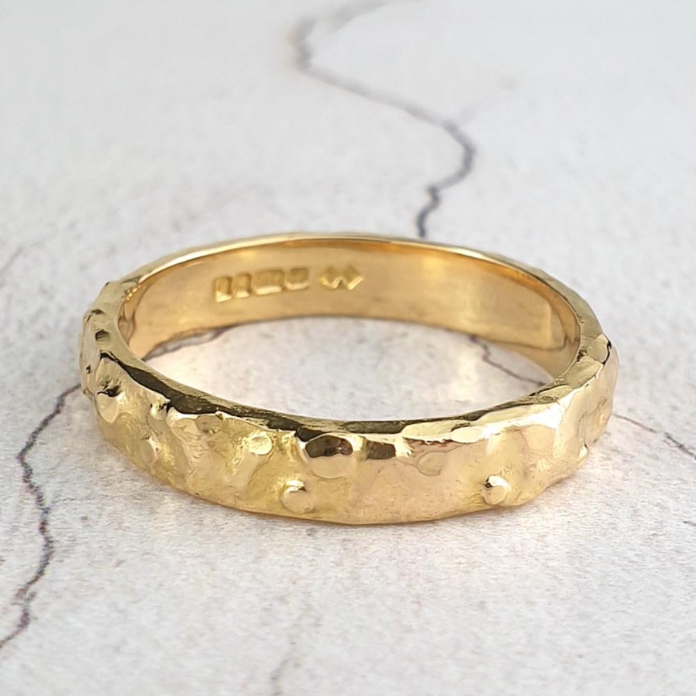 22ct gold band with a nugget texture