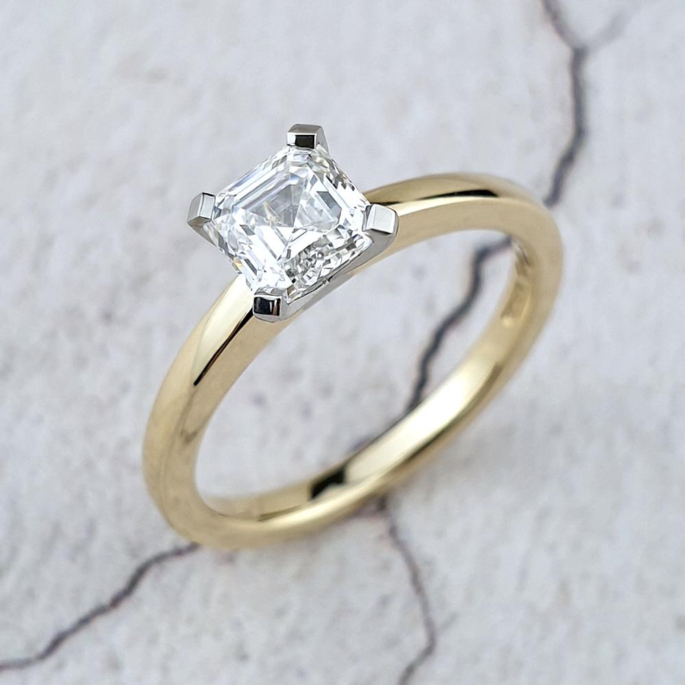 Asscher diamond in platinum claws on a gold band