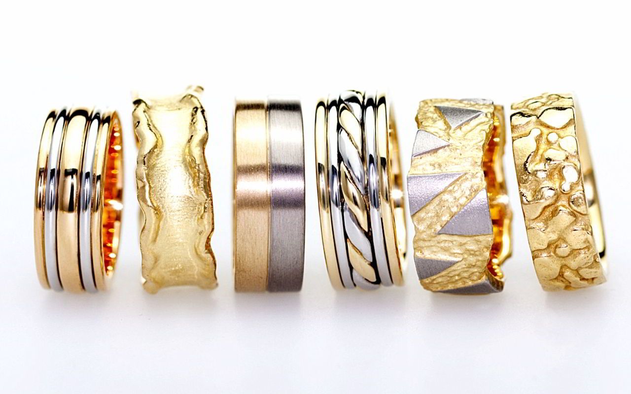 An assortment of handmade wedding rings in platinum and gold