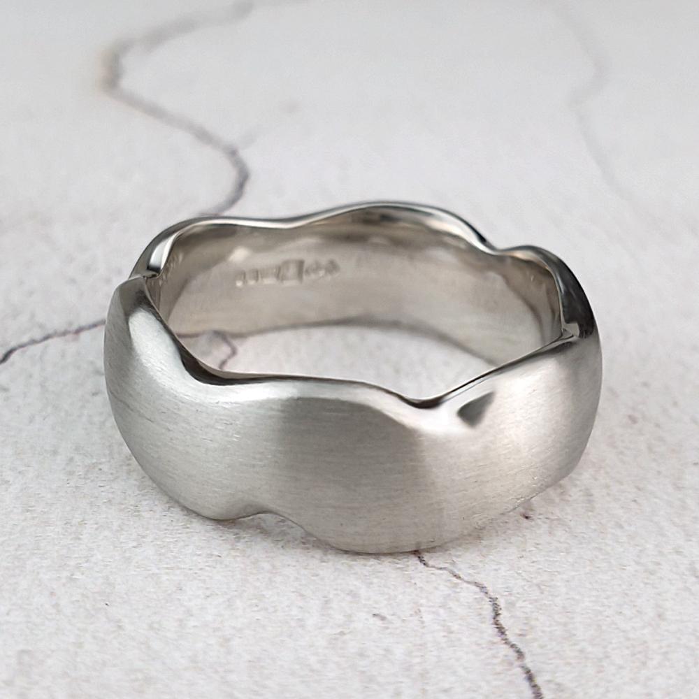 Carved platinum wedding band