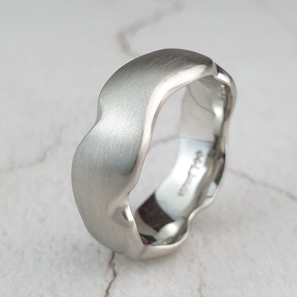 Plain carved wedding band with matte finish Carved platinum carved wedding ring with matte finish