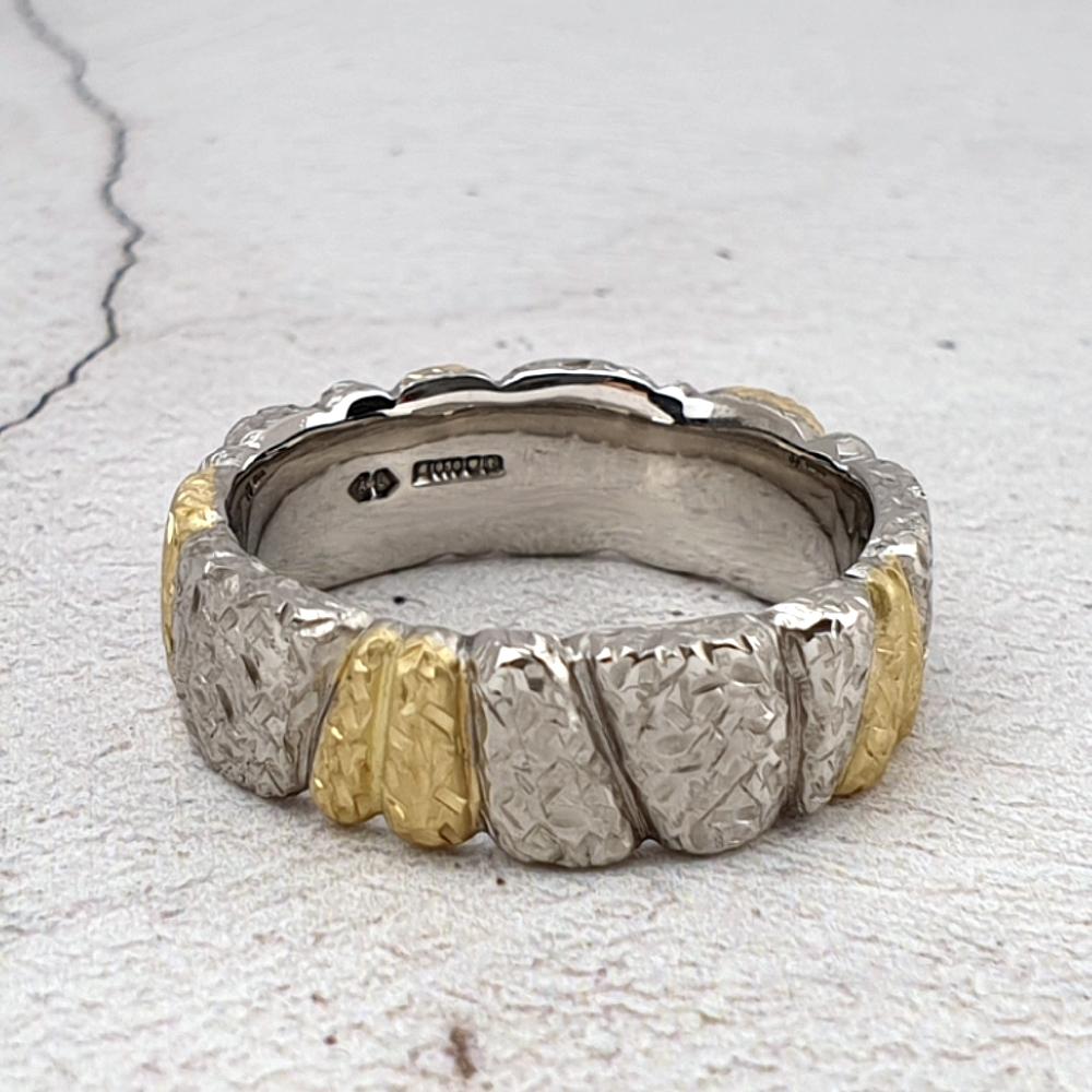 Palladium wedding ring with gold segments