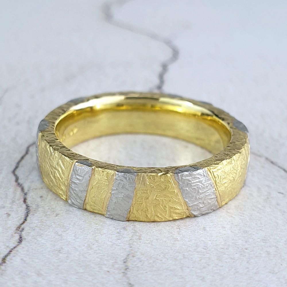 Textured yellow gold band with platinum stripes