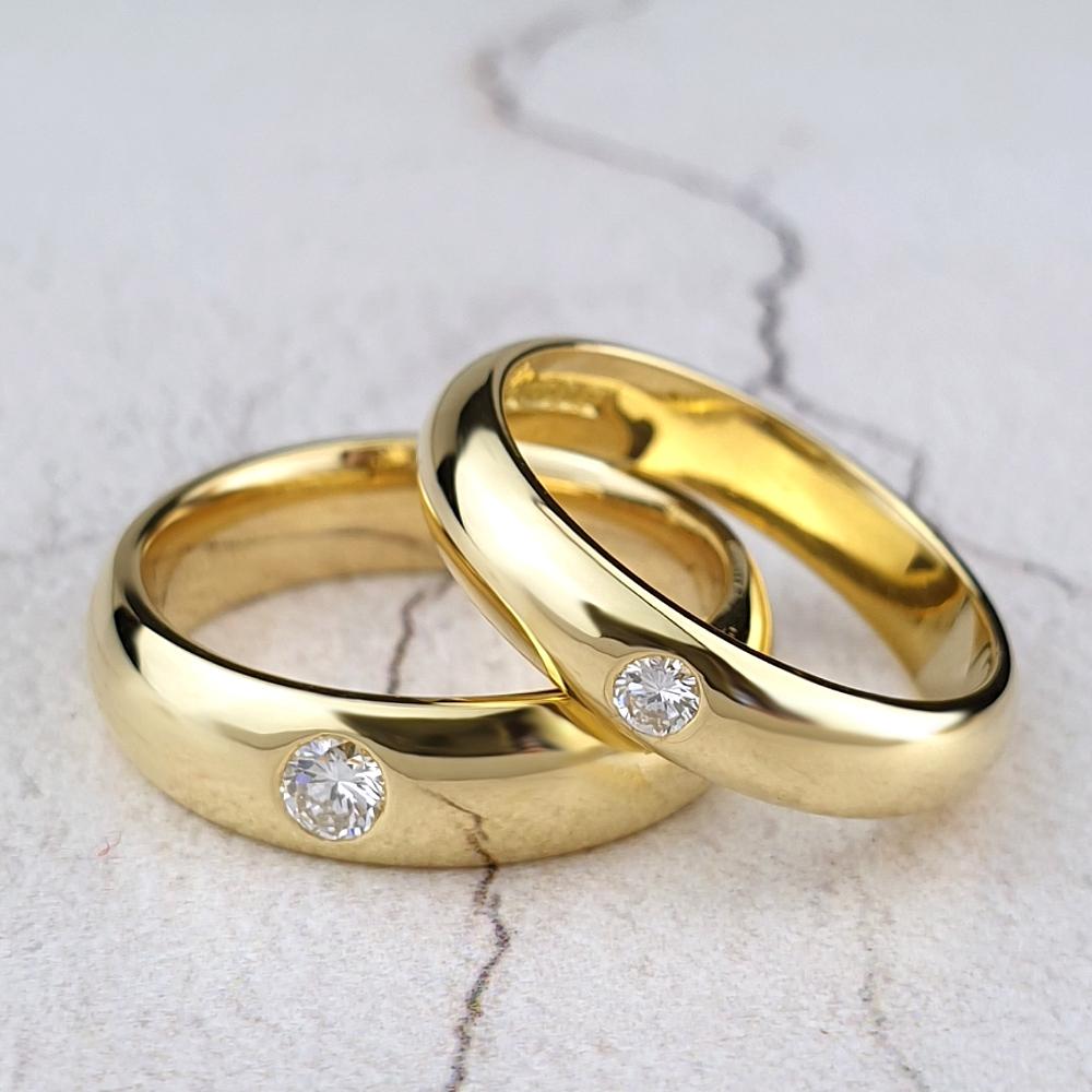 18ct yellow gold court rings with single gypsy-set diamond
