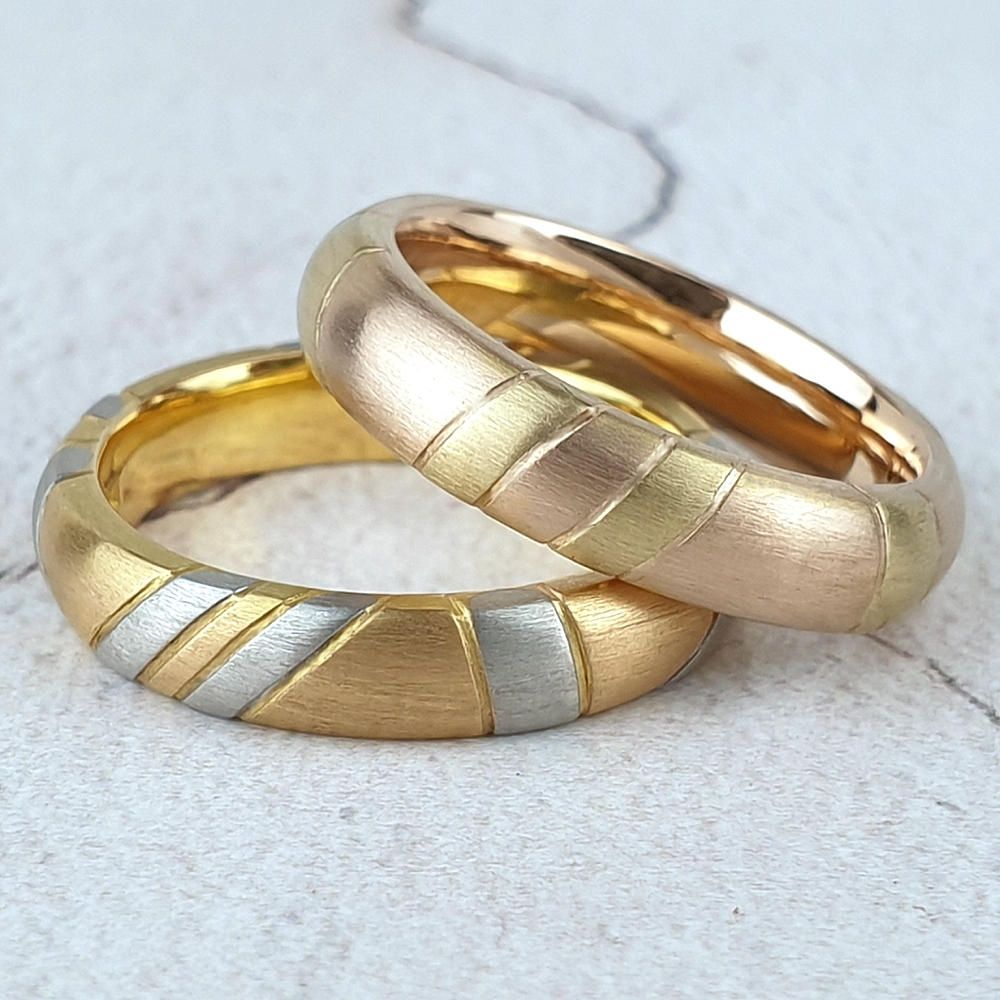 12 ct band with platinum stripes and 18ct red band with yellow gold stripes