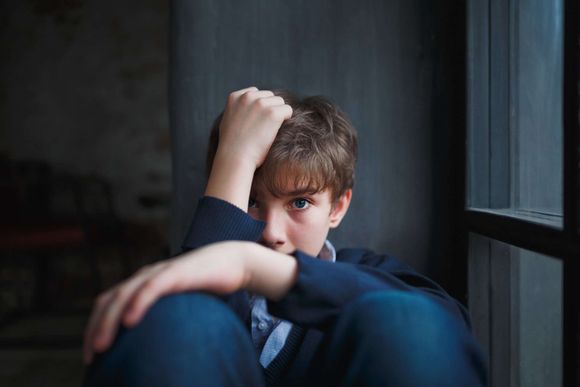 young boy  looking afraid or scarred