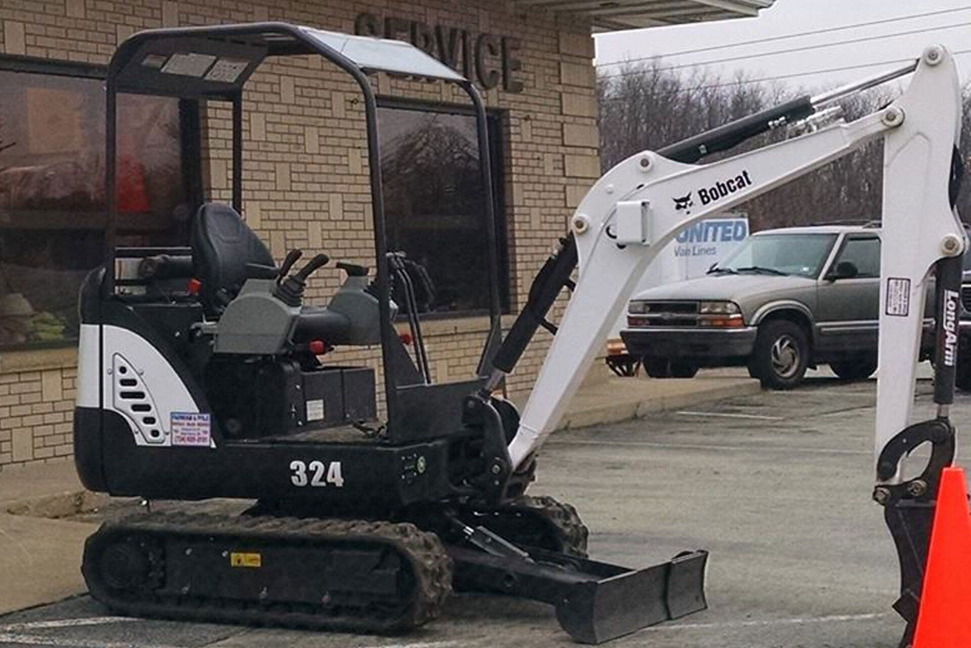 Parked White Excavator — Rostraver Township, PA — Phile & Farnham Rental & Sales