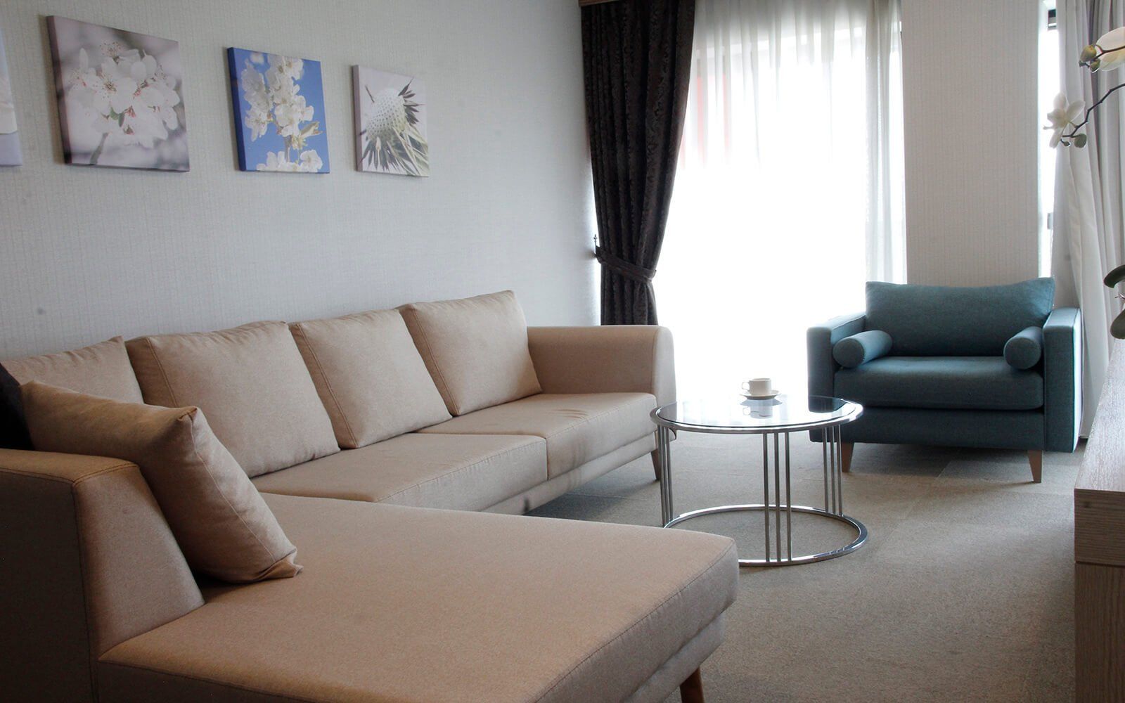 A living room with a couch a chair and a table