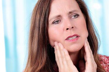 Elderly woman with tooth ache