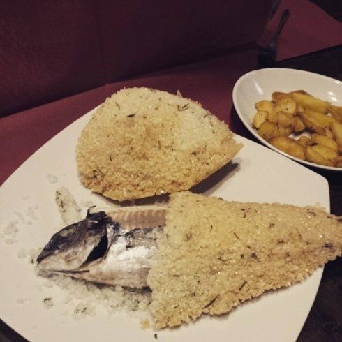 Sea bass with herbs in a salt crust