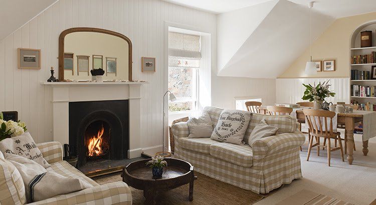 A living room with a fireplace and a couch