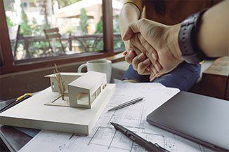 Roofing Contractor — An architect and businessman shaking hands with miniature house in Red Bank, NJ Roofing Contractor — An architect and businessman shaking hands with miniature house in Red Bank, NJ