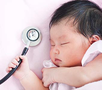 Medical Care — Infant Holding Stethoscope in Dover, PA