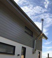 twin wall chimney lining system attached to the wall