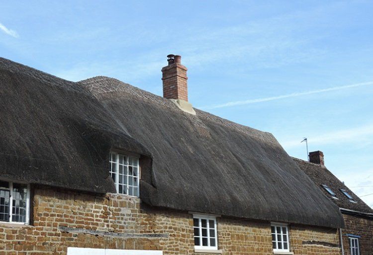 chimney on thatched roof