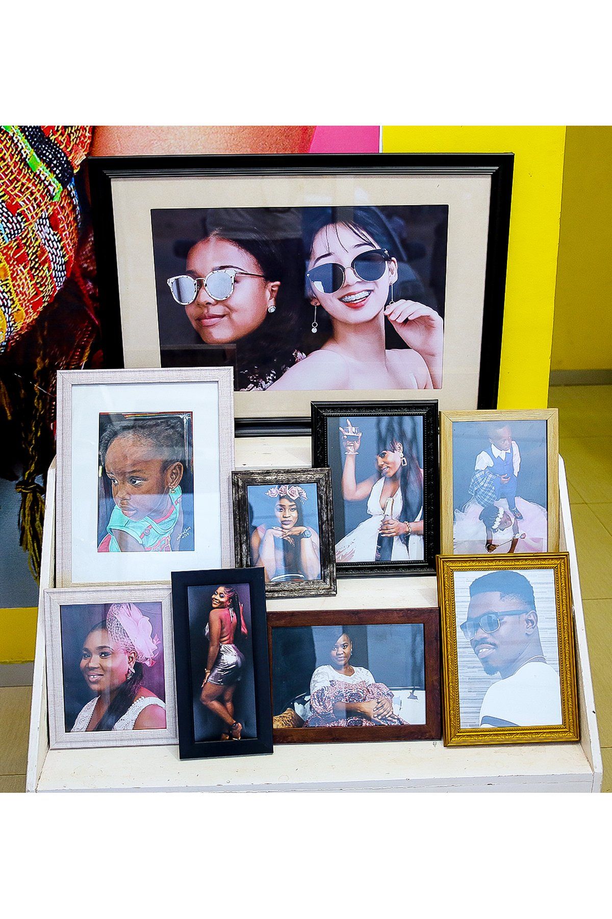 A bunch of pictures are sitting on a table.