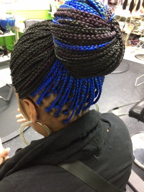 Stylish Black With Blue Hair Bun Braid — Wilmington, DE — Tess African Hair Braiding & Beauty Supply