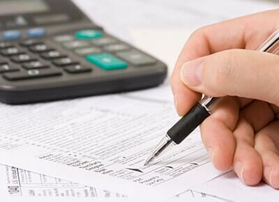 Person Filling up a form — Accountant in Woodstock, IL