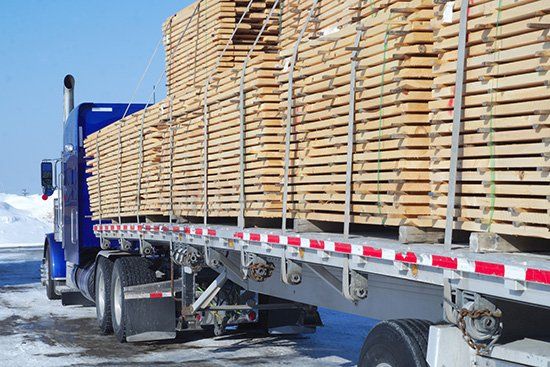 Wood transportation construction planks stack cargo - Lumber Contractor in Peoria, IL Wood transportation construction planks stack cargo - Lumber Contractor in Peoria, IL