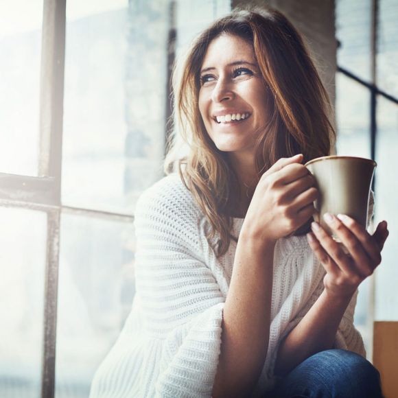 Shot of an attractive young woman relaxing at home