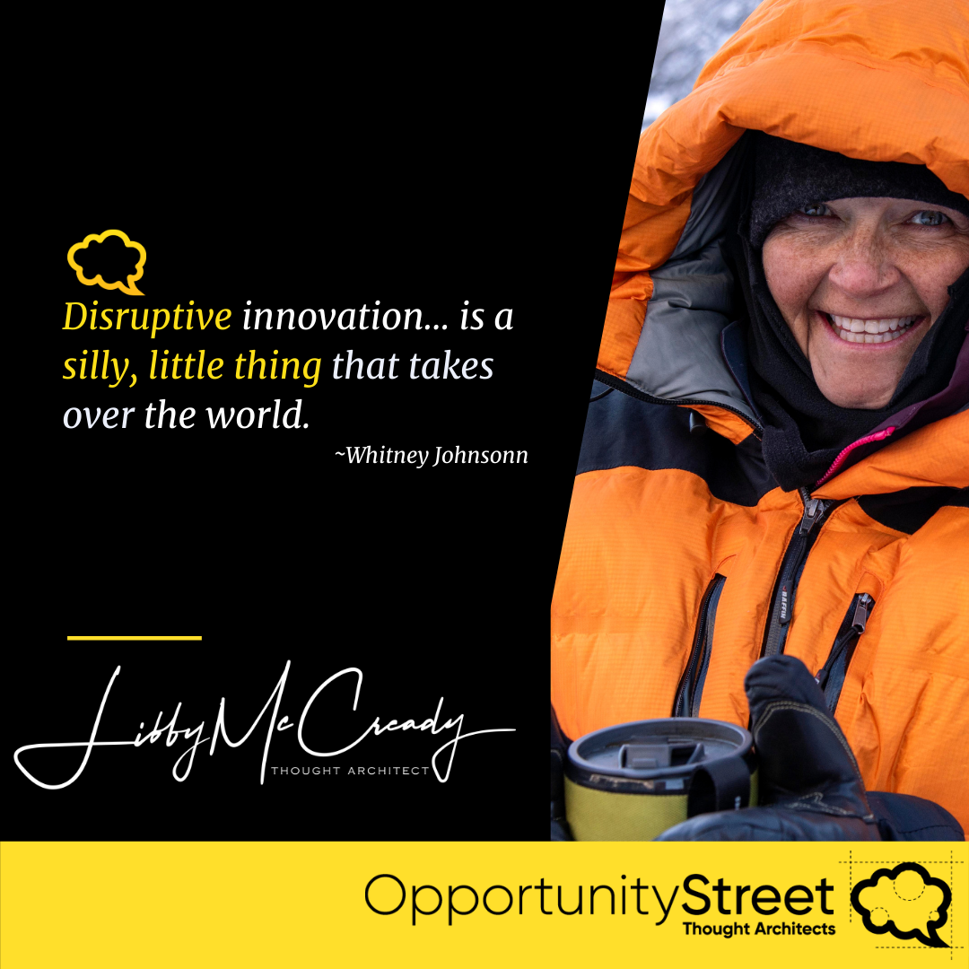 A woman in an orange jacket with a quote about disruptive innovation