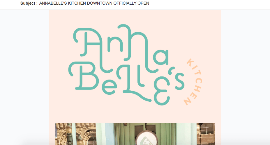 The logo for anna belle 's kitchen is on a pink background.