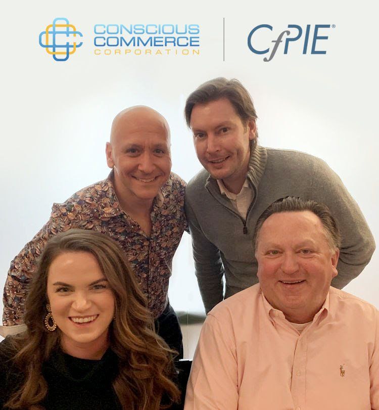 A group of people posing for a picture in front of a cpie logo