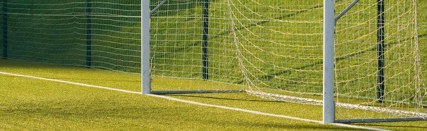 Goalposts on a green pitch