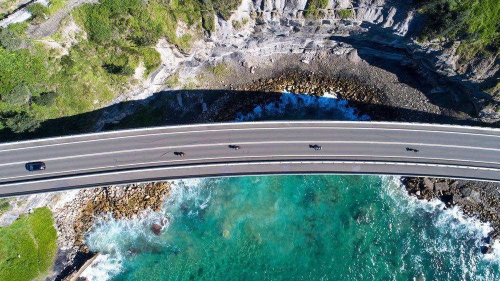 Drone Photography Over Sea Cliff Bridge — Complete Building Inspections in Kembla Grange NSW