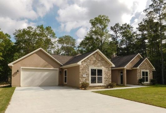 a house with a large garage and a driveway