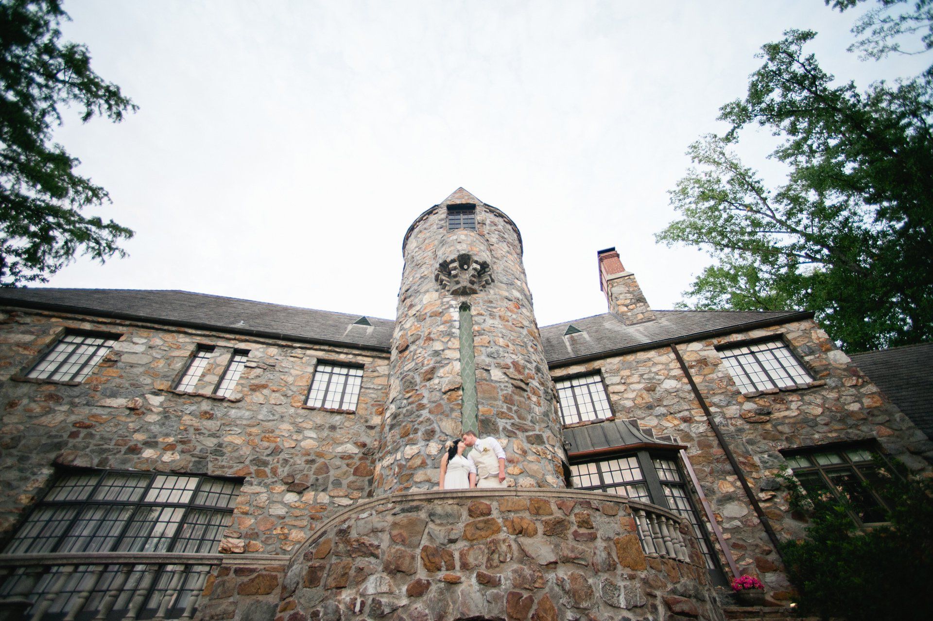bride and groom kiss at a castle wedding venue in arkansas