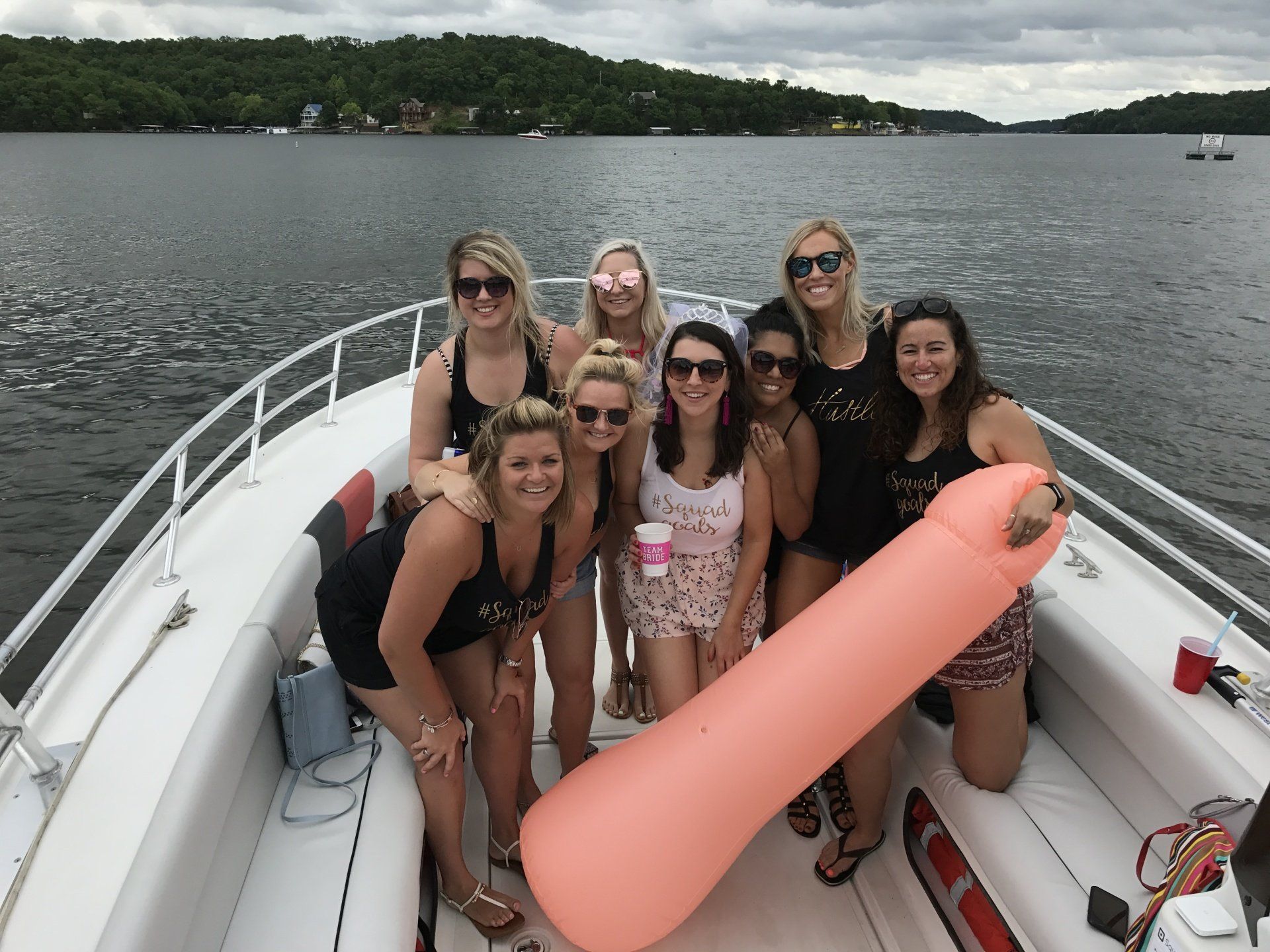 bachelorette party posing on water taxi at Lake of the Ozarks