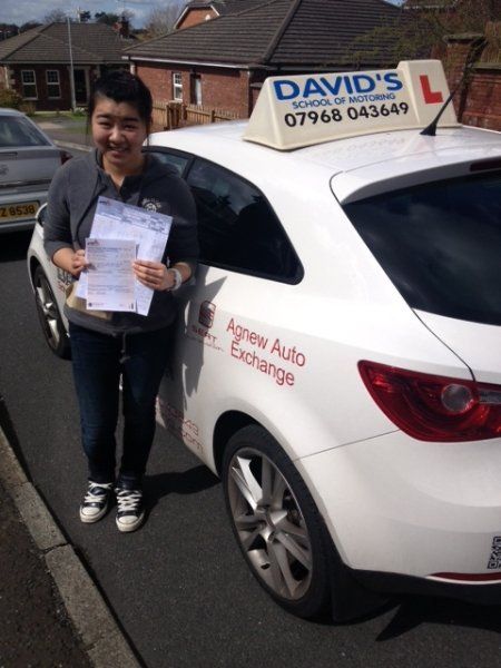 a lady happy after obtaining the certificate