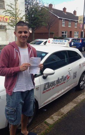 a man posing with a certificate