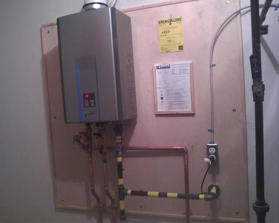The image displays a wall-mounted Rinnai tankless water heater. The image displays a wall-mounted Rinnai tankless water heater.