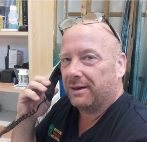 man using a landline phone