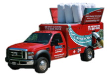 A red truck with foam bags on top of it