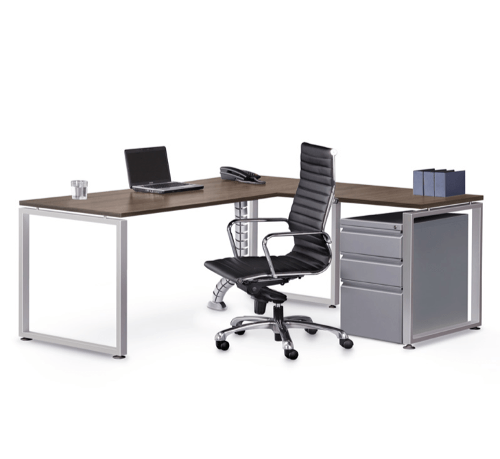 L-shaped office desk with a laptop, phone, and black chair. A filing cabinet is beside the desk.