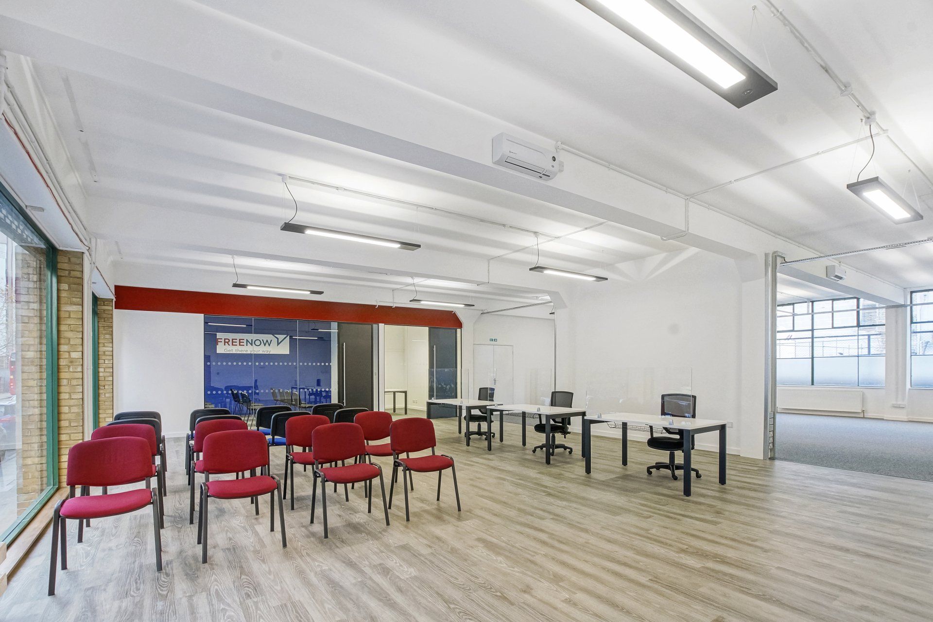 A large room with tables and chairs in it