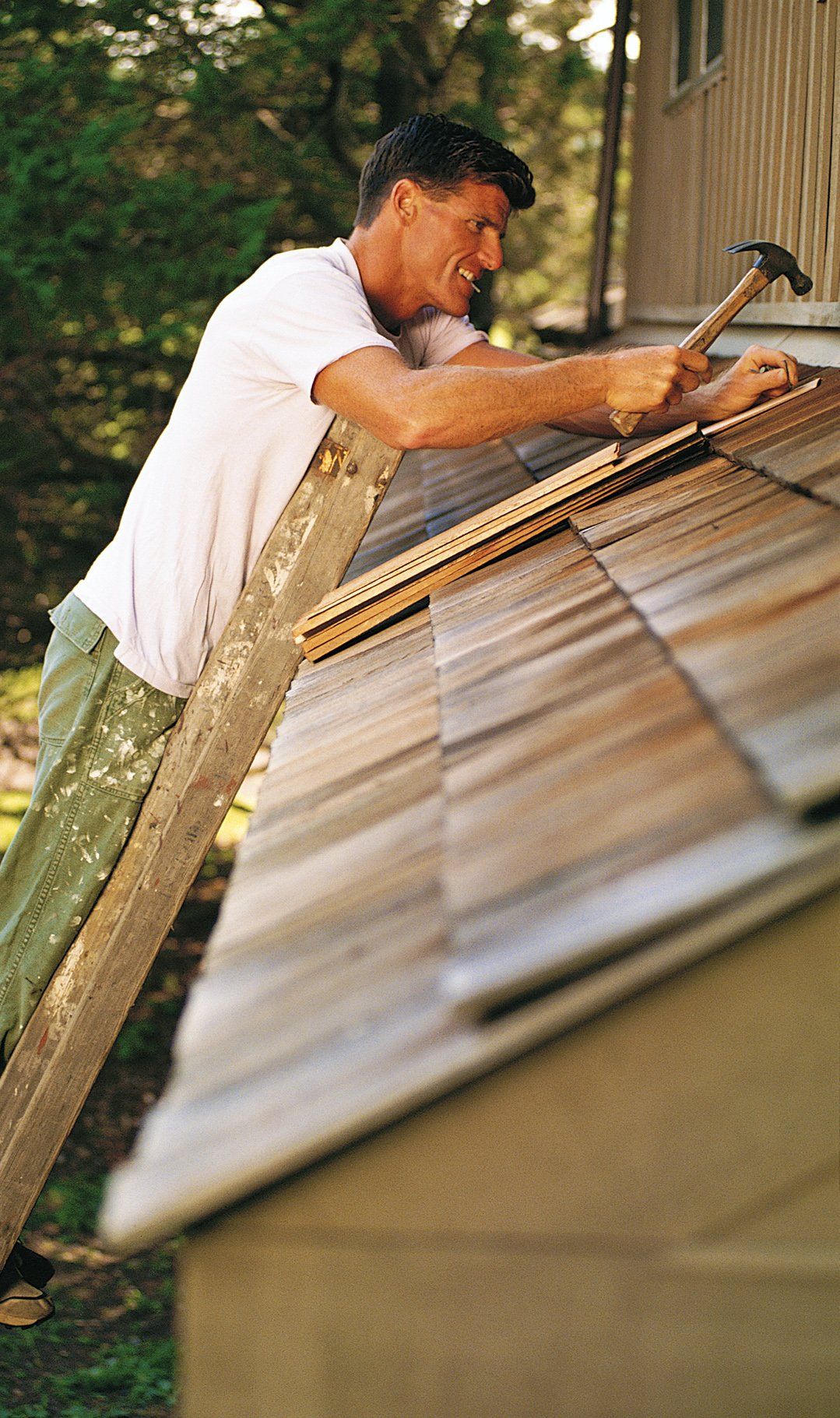 Man fixing a roof - roofing, roofers, roofing contractors, re-roofing, residential roofing, commercial roofing, new roof in Riveerside CA Man fixing a roof - roofing, roofers, roofing contractors, re-roofing, residential roofing, commercial roofing, new roof in Riveerside CA