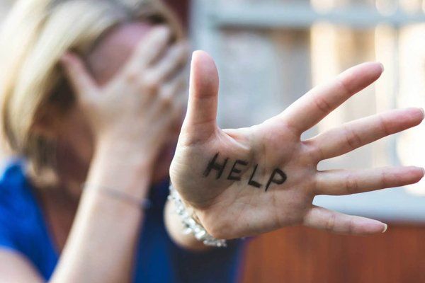 Woman With Word Help On Hand — Fresno, CA — Law Office of Ralph Torres